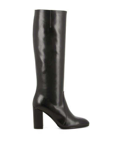 A black leather pull on knee high Italian leather boot by that features a concealed ankle gusset, a 8cm block heel and a rounded almond toe by Lorenzo Masiero. This style is true to size.