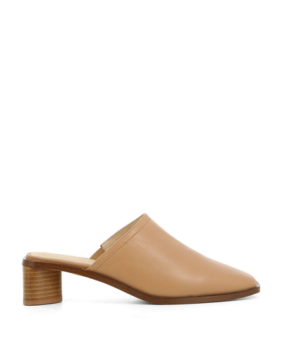 Chic camel leather slip on mules featuring a low wooden block heel and a closed square toe by 2 Baia Vista.