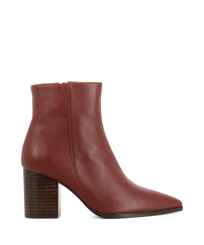 Red leather ankle boots that have inner zipper fastening and feature a 7.5 cm block heel and a pointed toe by Zomp.