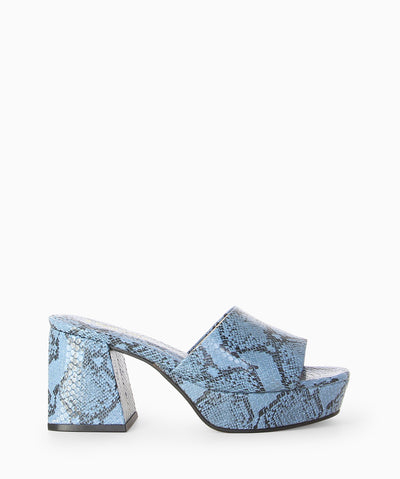 Blue leather platform mules with snakeskin embossed upper, block heel and a round toe.