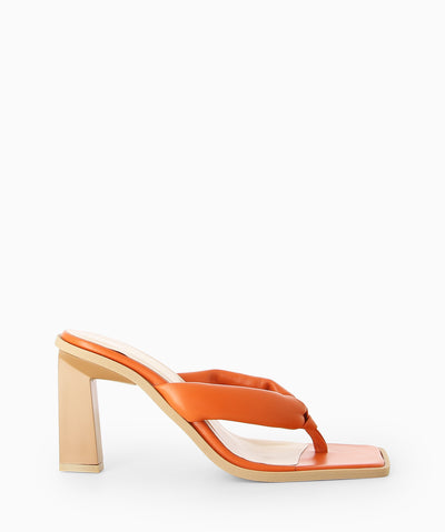 Orange leather heeled sandals with padded thong straps, a cushioned insole and a square toe.