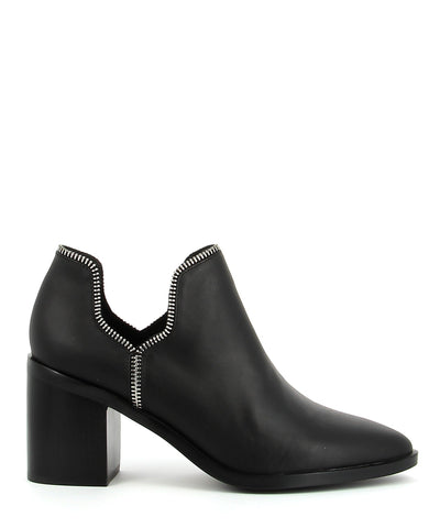 A black leather ankle boot by Senso. The 'Huntley' features a block heel, zipper fringing and a soft pointed toe.